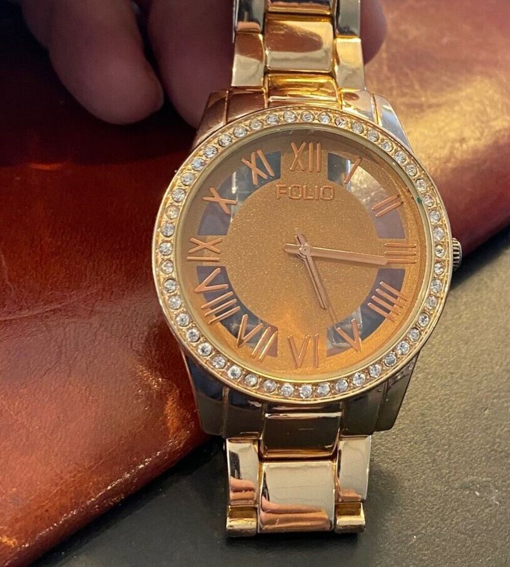 Women's Gold Tone Folio Watch, Crystal Accented Bezel, Roman Numeral Dial